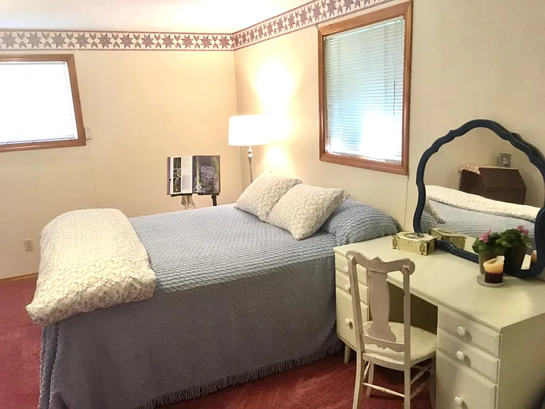 Main bedroom. There's lots of space here that the photo doesn't show. The pink carpet is being replaced with beige.