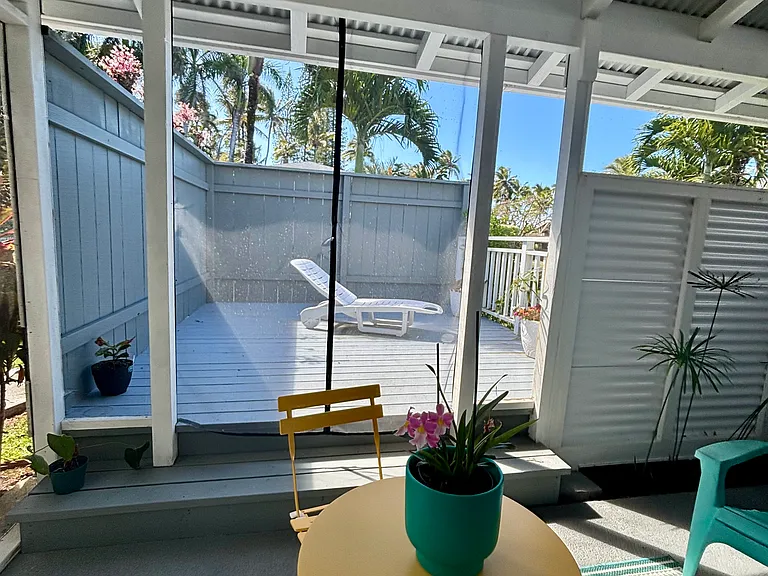 Outdoor living space. Covered Screened in Lani. Private deck with ocean view