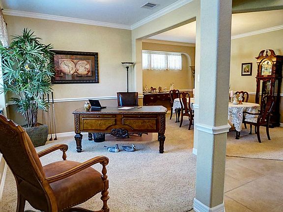 ANOTHER VIEW OF THE FORMAL LIVING/STUDY THAT OPENS TO THE DINING ROOM