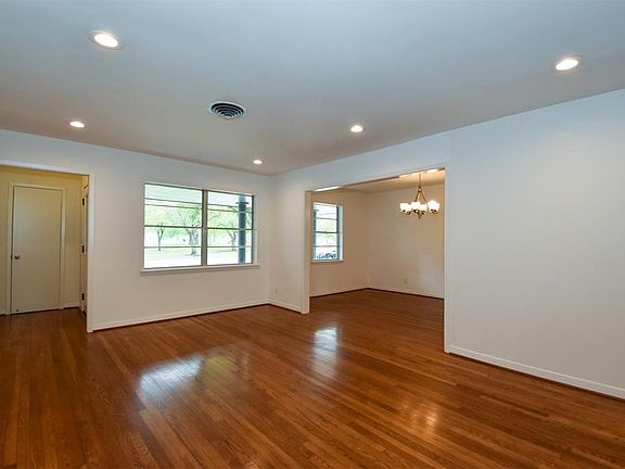 Enter home with view from front to backyard, formal living and formal dining room with recessed lights, and beautiful hardwood floors. Lots of natural light!