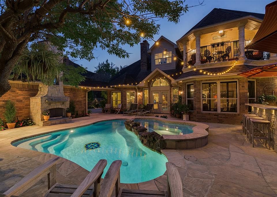 Welcome to your very own Over the Top Back Yard Retreat complete with Pool,Spa, Fireplace and Outdoor Kitchen surrounded by Lush Landscaping and Mature Trees. The Spill-Over Feature of the Spa along with the expansive Flagstone Deck culminates into t