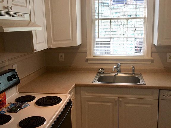 Kitchen with electric stove, dishwasher, refrigerator and pantry