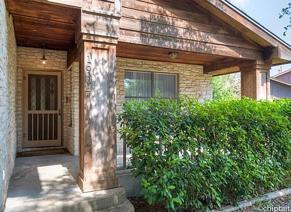 Entrance to home with covered porch.