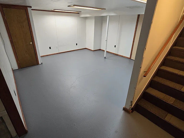 View of finished portion of Basement from Staircase.