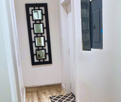 Cozy hallway with modern decor and a welcoming atmosphere.