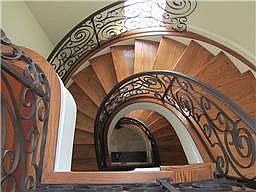Spiral staircase with custom wrought iron railing