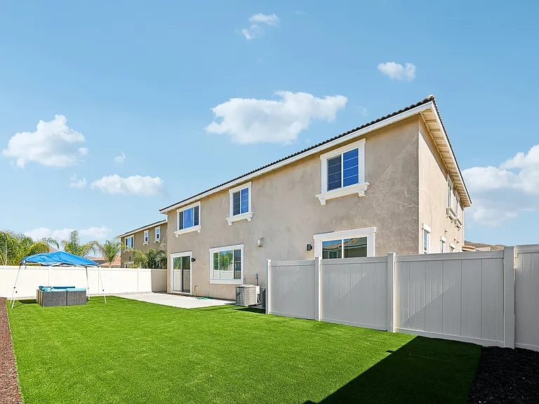 A well-maintained backyard designed to make every guest feel at home!