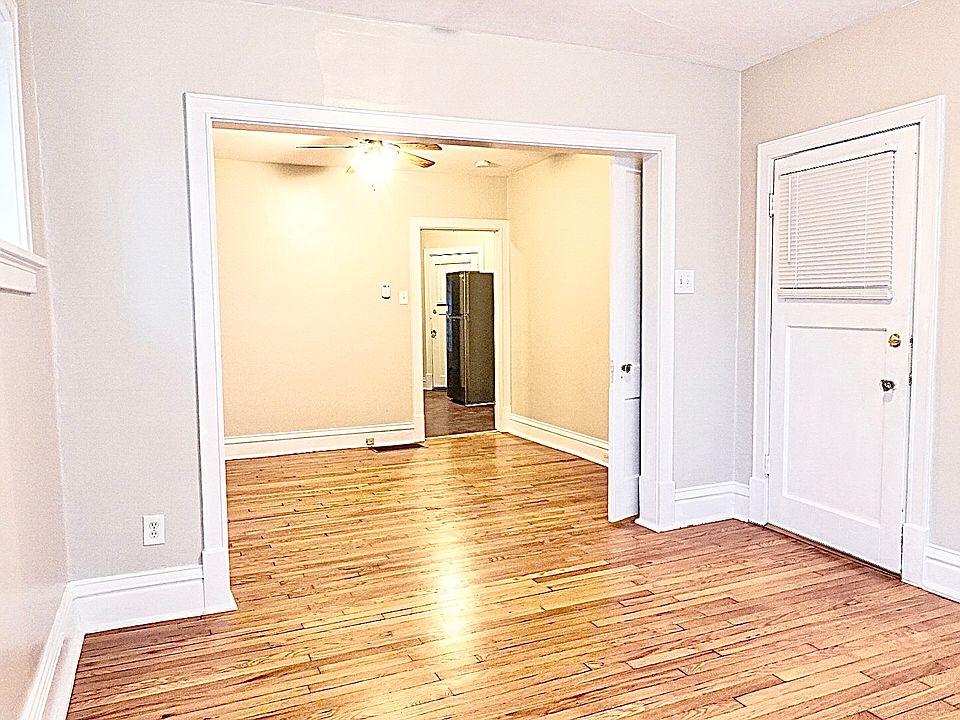 Spacious living room looking into the open concept dining room.