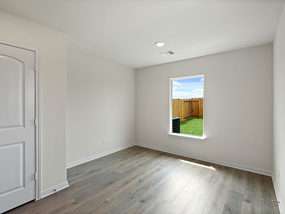 The dining room has a large window that lets in great, natural light.