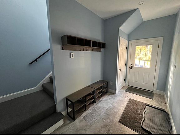 Spacious mudroom, private entrance. Large storage closet under the stairs.