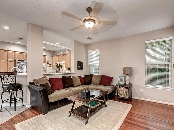 Spacious living room with easy access to the dining and kitchen for entertaining.