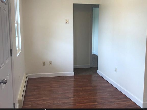 Area suitable for computer station/desk; front door, left