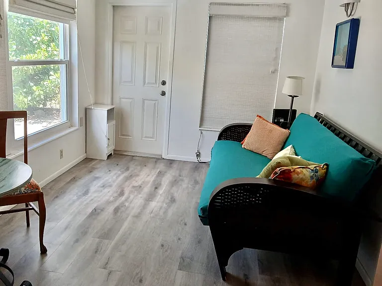 Breakfast in the sunroom! Need extra guest space, no problem, just use the futon sofa.