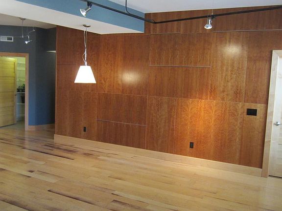 Living Room w/ view of laundry pantry (left) and master bedroom door (right)