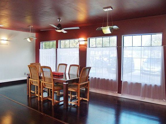 Sophisticated Dining area with Bistro-style windows and modern fixtures