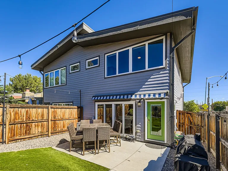 Backyard patio with remote controlled retractable awning