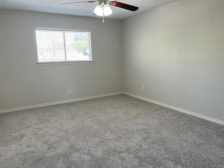 One of three bedrooms on the second level.