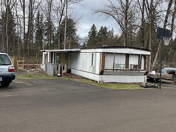 Front with paved parking.