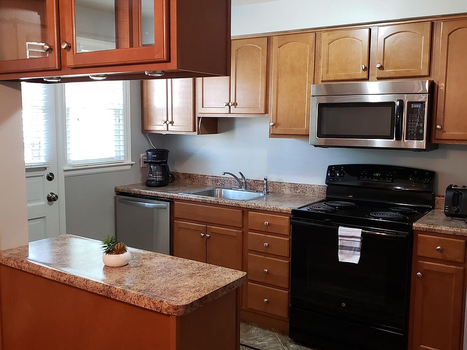 great galley kitchen with exit to parking and 3rd St