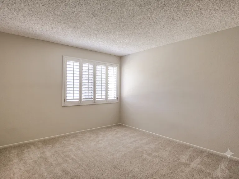 Bedroom #1 - carpets and shutters. Picture from previous listing