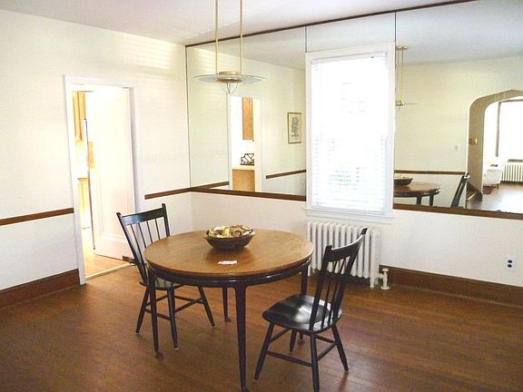 Entertainment sized Dining Room with wood floors