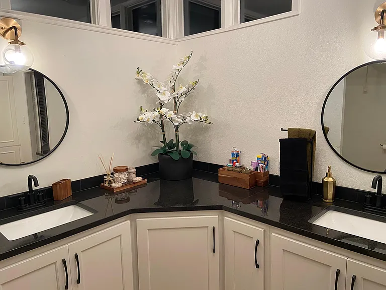 Granite countertops, large vanity with loads of storage and double sinks in master bathroom