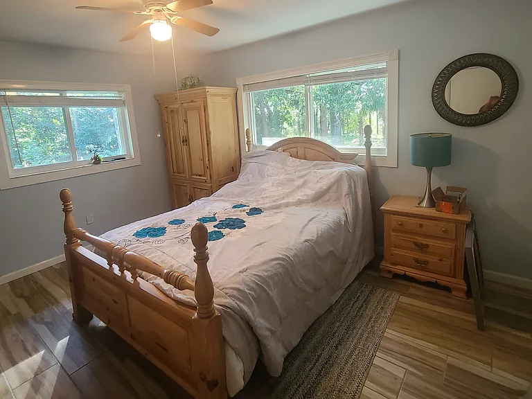 Queen bedroom with window views