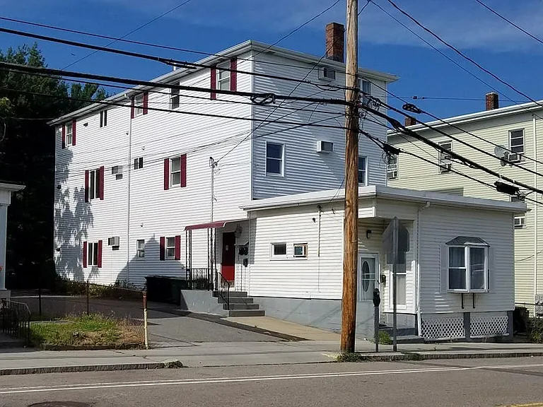 The studio is the front portion of the 4 unit building