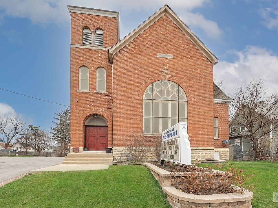 Beautiful Brick Church with arched Stain glass window.