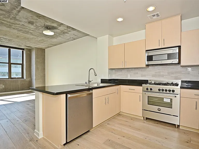Kitchen and living room (no furniture view)