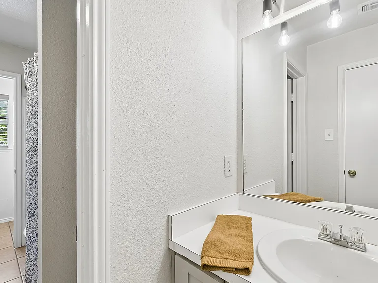 Sink area across the hall from Bedroom 2 leading to bathroom area