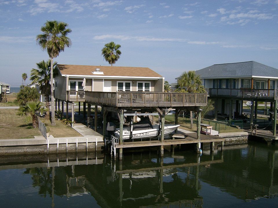 Beautiful view of home and boathouse taken from across the canal