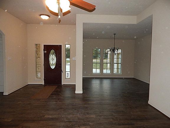 Entry door and formal dining room to the right