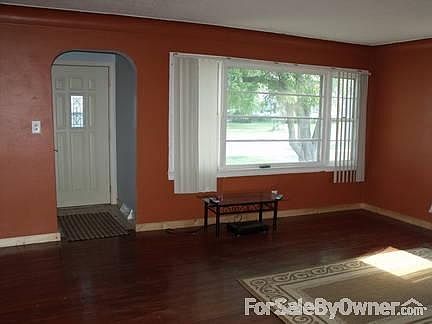 Living Room
						:
						Hardwood floors thru main level of home. This is the large front window.