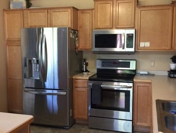 Recently updated stainless steel appliance and kitchen sink faucet.