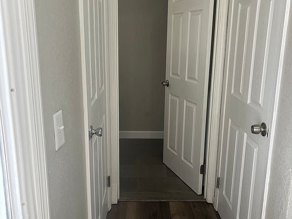 Immediate to the left the downstairs guest restroom . Behind the door is the new washer and dryer .