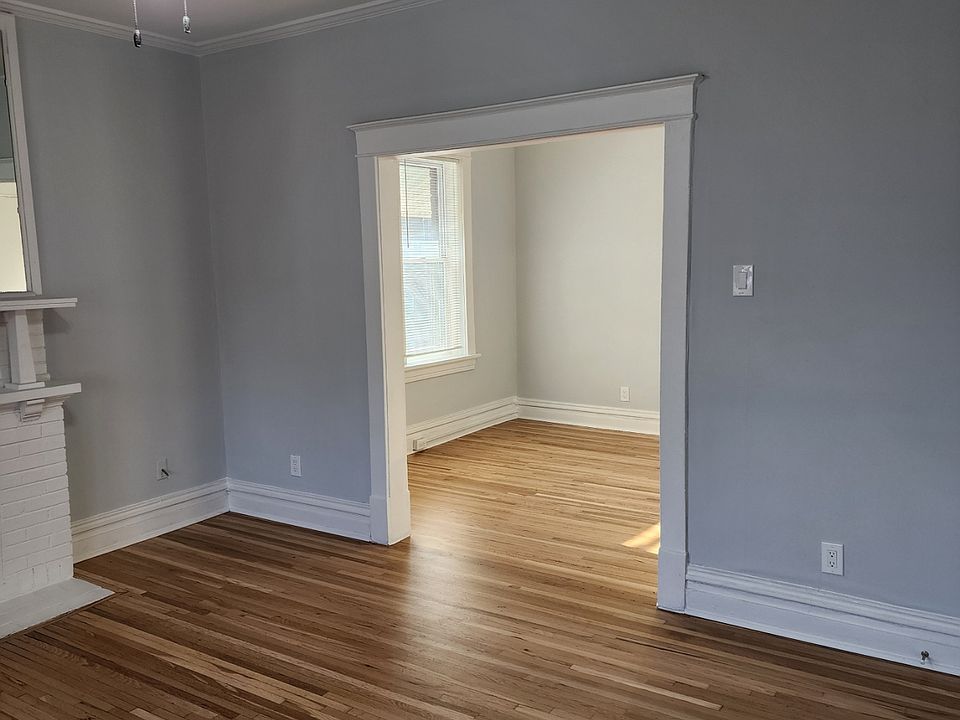 Front room walking into the unit. Beautiful just refurbished original hardwood floors