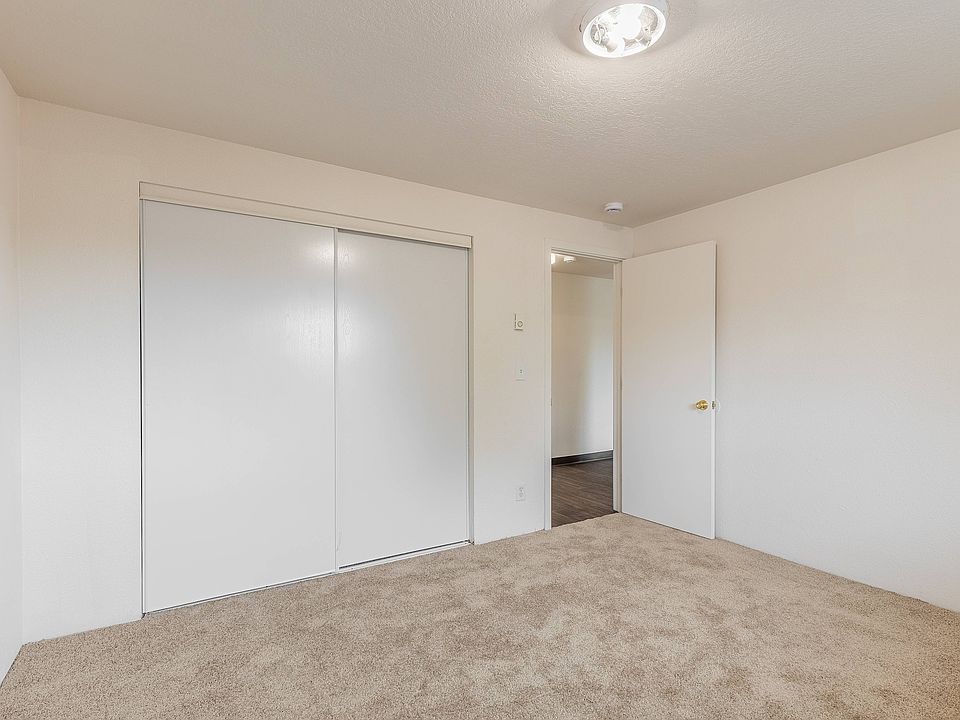 Bright and spacious bedroom at Fox Pointe Apartments in Portland, perfect for comfortable living.