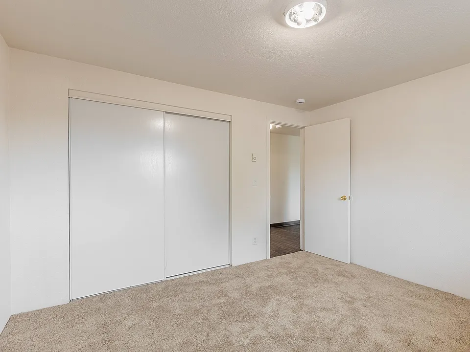 Bright and spacious bedroom at Fox Pointe Apartments in Portland, perfect for comfortable living.