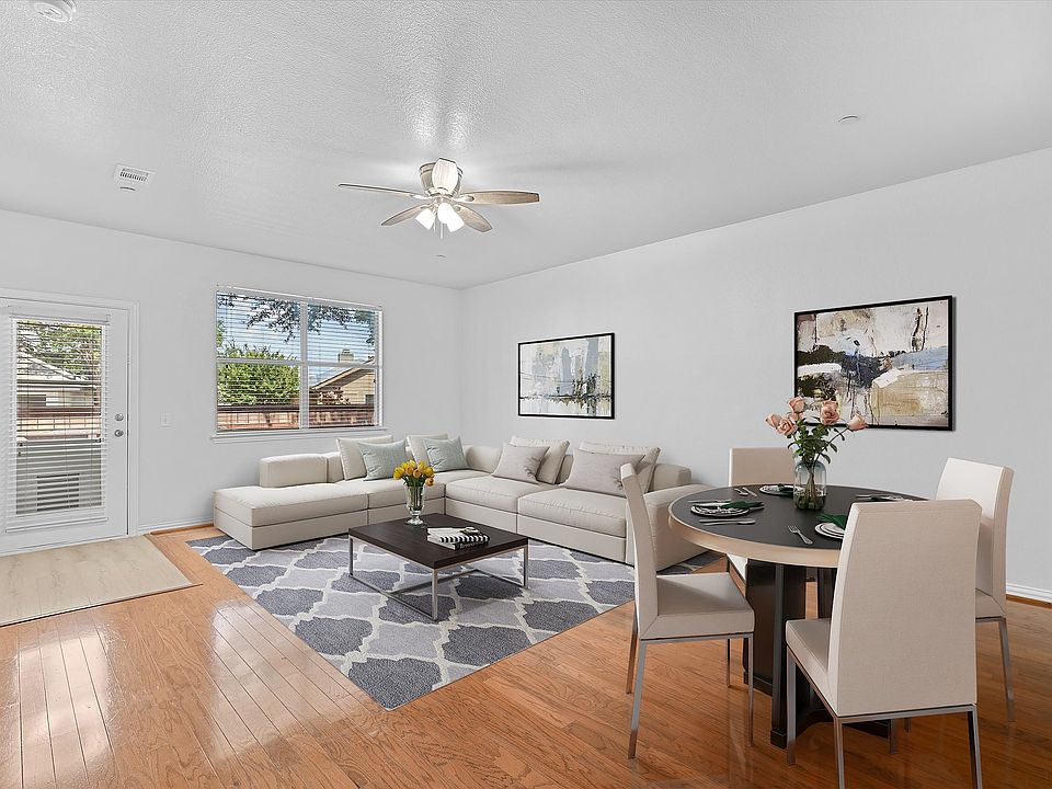 Living and dining room staged to show potential