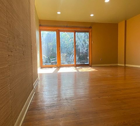 Living Room to Sliders vacant view