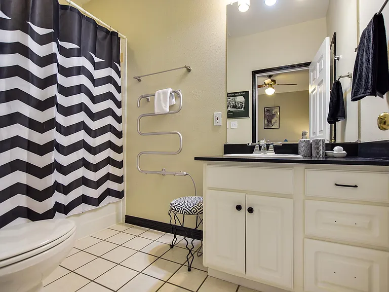 Bathroom #4 has quartz counters & a towel warmer for a boutique hotel feel.