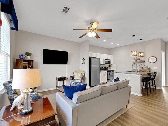 Living room, kitchen and breakfast bar.