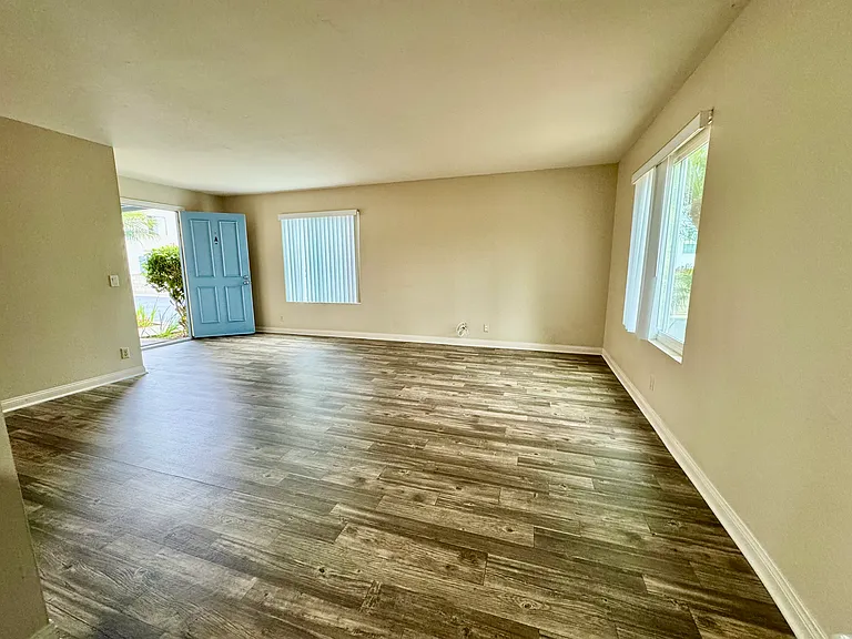 View from kitchen into living room and front door