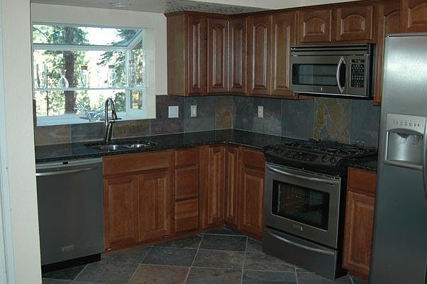 Cherrywood, granite, stainless steel and slate