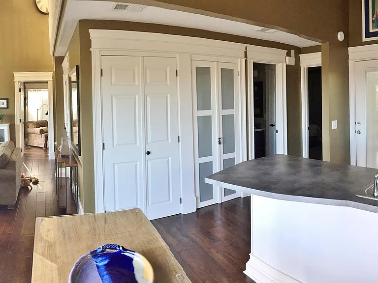 Plenty of pantry storage and washer/dryer with utility shelves.