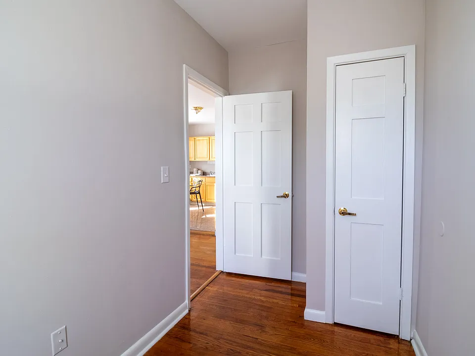 Spacious primary bedroom in Claystone Commons apartments Hartford CT