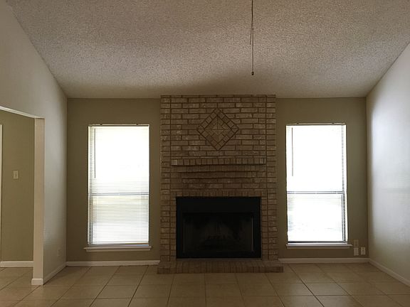 Living room/brick fireplace 