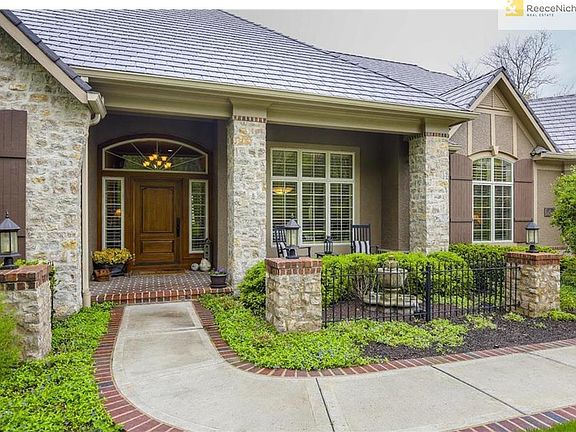 This Custom designed home is perfectly situated across the street from the Lake with a neighbor on only one side and backs to open grassy common area with walking trail. Two Mahogany wood front entry doors Large Main front door & Walk thru garage door