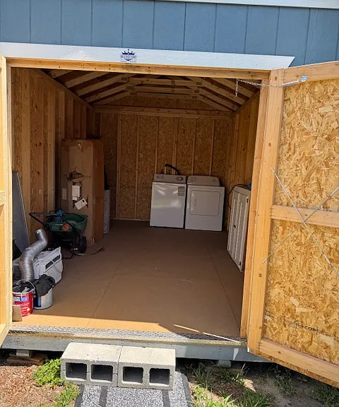 brand new shed 10' x 16'. New Maytag washer and dryer. Lots of room for storage.